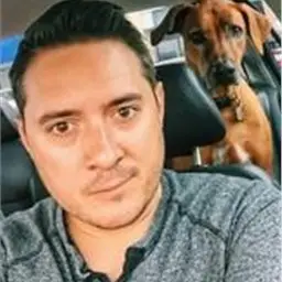 Our Team 3 A Man Taking A Selfie With A Dog
